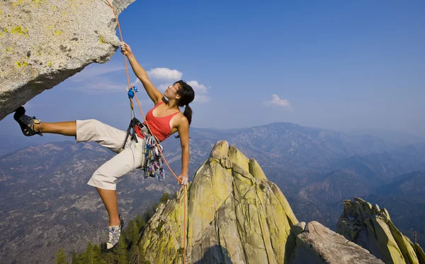 Female rock climber rappelling. — Stock Photo #5543762
