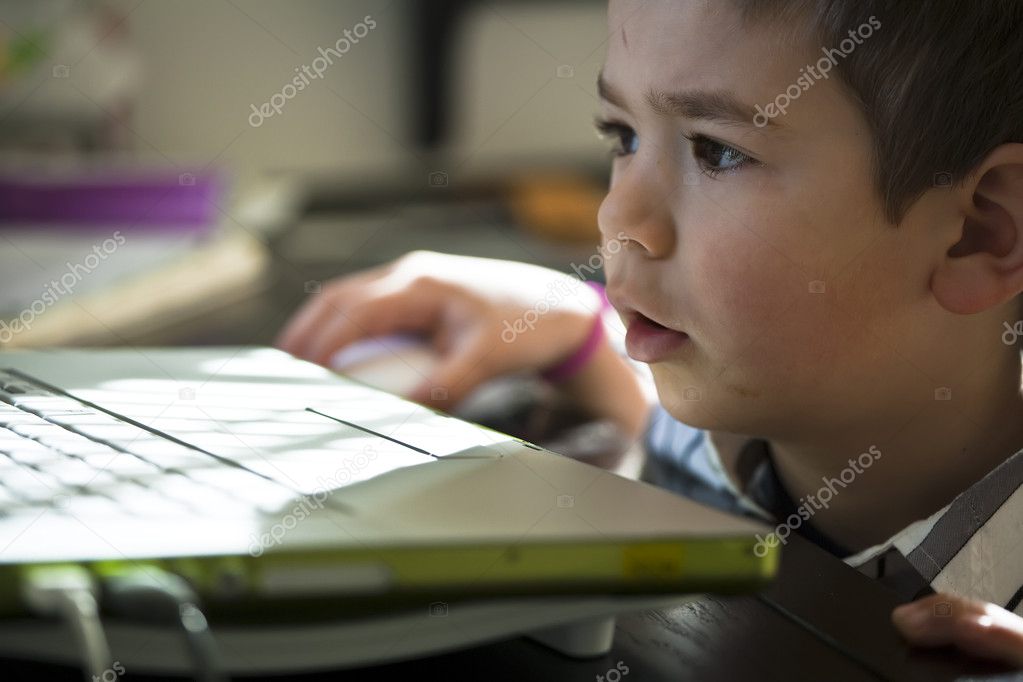 depositphotos_5903814-Young-boy-working-on-computer..jpg