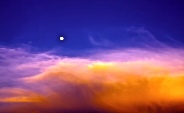 Beautiful sky and clouds with full moon in twilight time