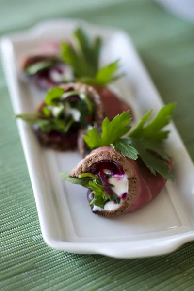 Beef rolls with beets and sour cream