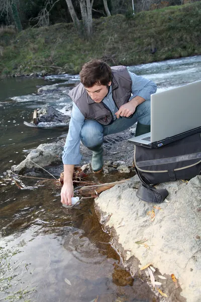Biologists testing water of natural river
