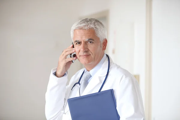 Doctor standing in hall — Stock Photo #6701390