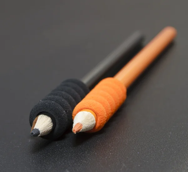 Black and orange pencils