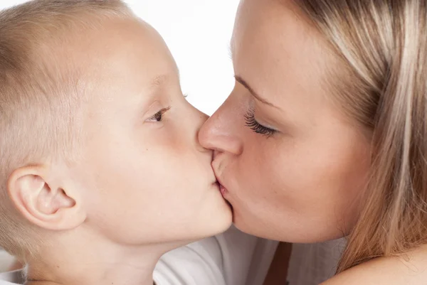 Mom and son kissing