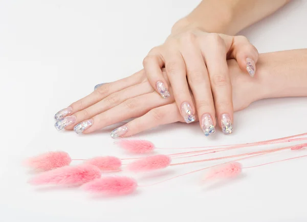 Sparkle manicure and pink decoration