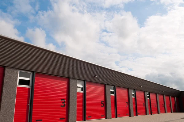 Storage building with red doors
