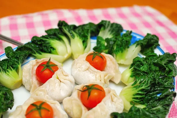 Chinese dumplings and vegetables