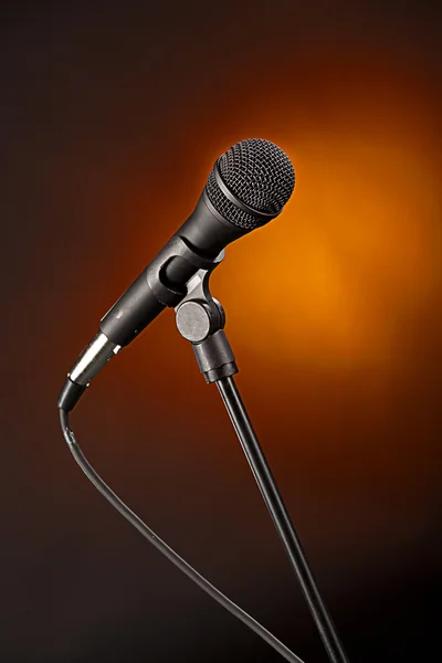 Microphone on Spotlight Gold Backgorund