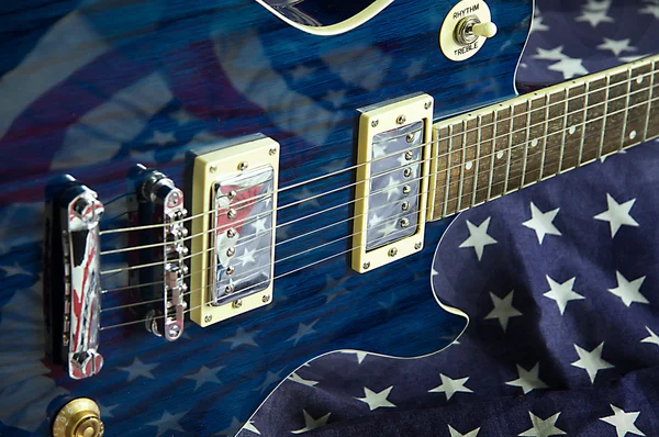 Blue Guitar on Flag Background