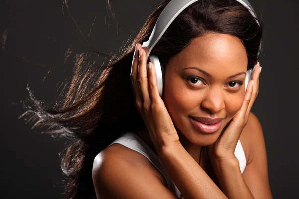 Happy woman wearing headphones