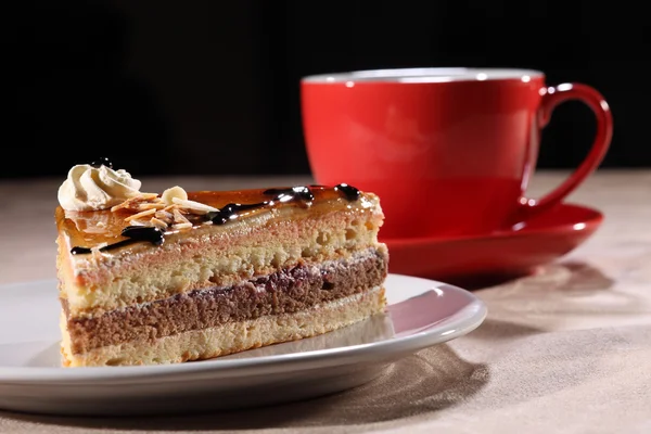 Slice of dessert cake with coffee for break time