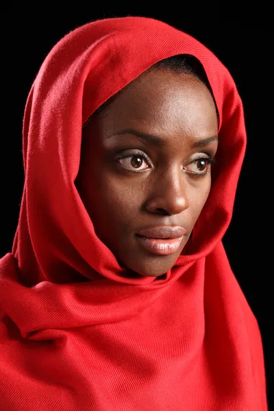 Religious african amercian woman in red headscarf
