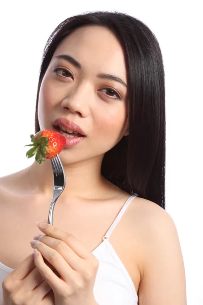 Sexy chinese teenager eats fresh strawberry fruit by Darrin Henry Stock 