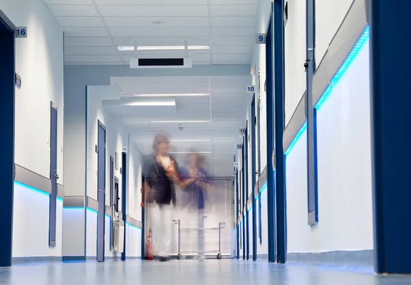 Hospital corridor blurred figures