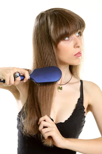 dep_6398205-Woman-combing-her-long-hair-with-hairbrush.jpg