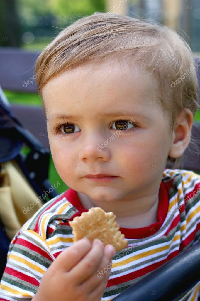 Boy Eating Biscuit