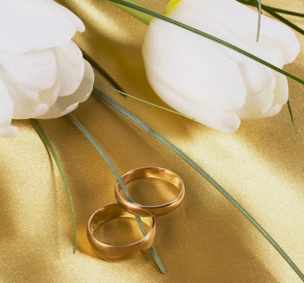 Wedding rings and flowers by Irina Ukrainets Stock Photo