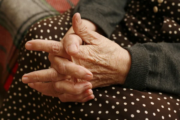 Hands of the elderly woman