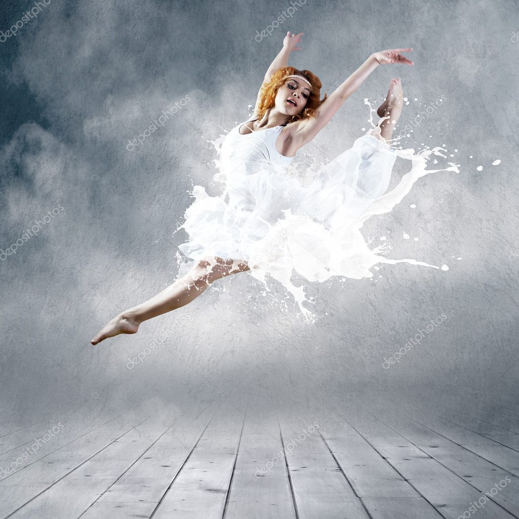 Jump of ballerina with dress of milk
