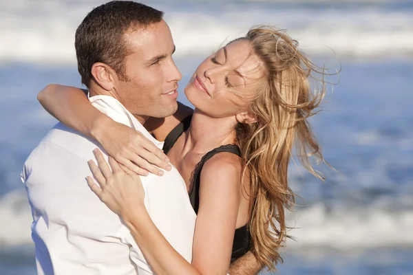 http://static6.depositphotos.com/1135494/647/i/450/depositphotos_6478841-Man-and-Woman-Couple-In-Romantic-Embrace-On-A-Beach.jpg