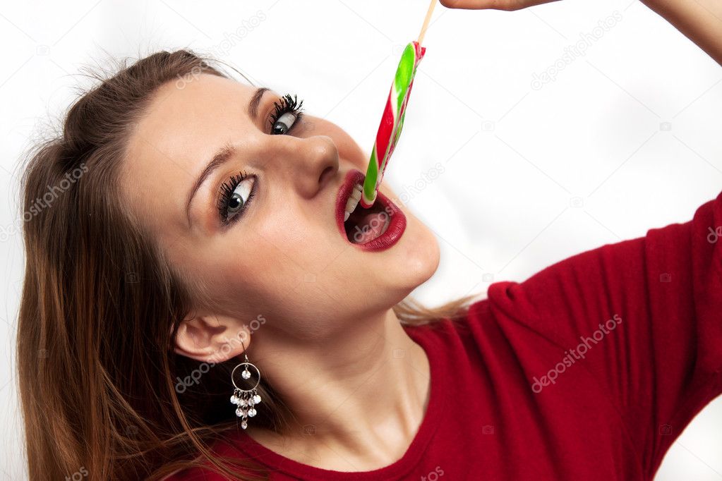 Beautiful girl eating a lollipop Stock Photo 169 donbasilo 6334432