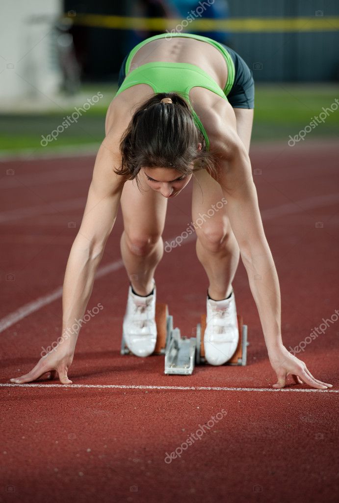 Action Packed Image Of A Female Sprinter Leaving Starting