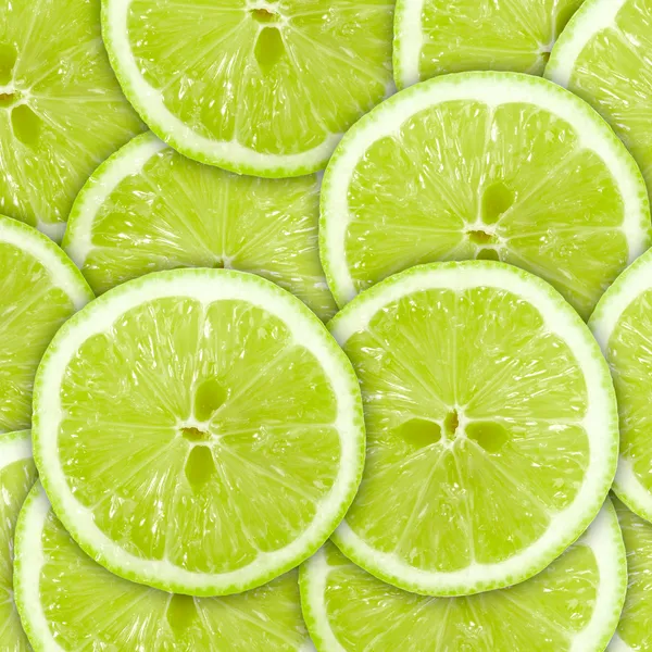 Abstracte groene achtergrond met citrus-fruit van kalk plakjes — Stockfoto