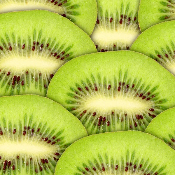Fondo verde abstracto con rodajas de kiwi crudo — Foto de Stock
