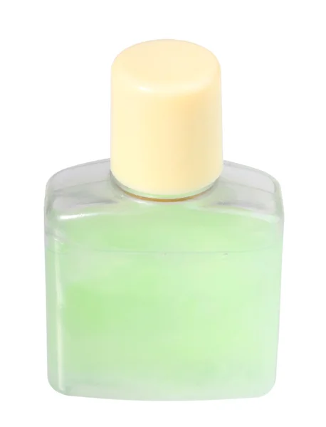 Creme cosmético verde em garrafa transparente — Fotografia de Stock