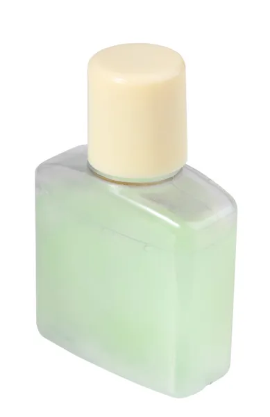 Зеленый косметический крем в прозрачной бутылке — стоковое фото