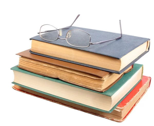 Óculos e grupo de velhos livros sujos — Fotografia de Stock
