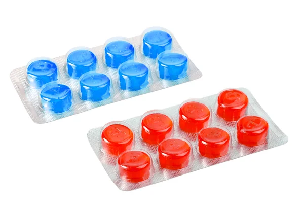 Dva kovové blistr s červené a modré pilulky — Stock fotografie