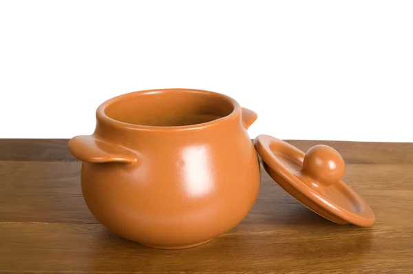 Ceramic pot on the wooden board — Stock Photo, Image