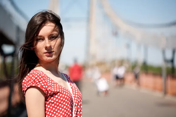 Beauty young woman on the bridge — Stock Photo, Image