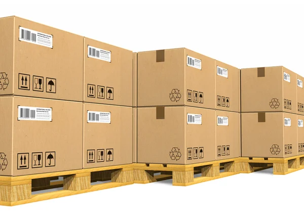 Pilhas de caixas de papelão em paletes de transporte — Fotografia de Stock