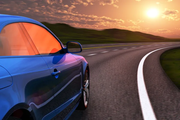 Blue car driving by autobahn in sunset with motion blur — Stock Photo, Image