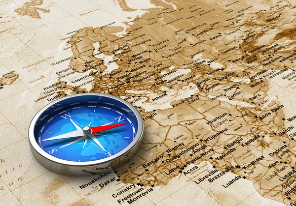 Modrý kovový kompas na staré mapě světa — Stock fotografie