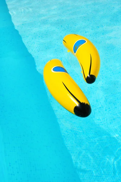 Banana in swimming pool — Stock Photo, Image