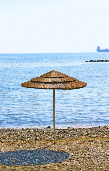 Umbrella on beach — Stock Photo, Image