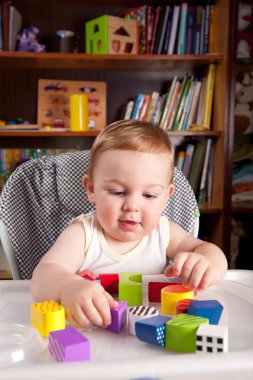 A boy and colorful blocks clipart