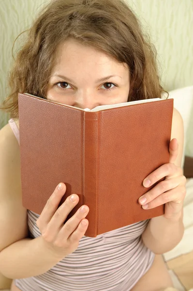 Hiding over book — Stock Photo, Image