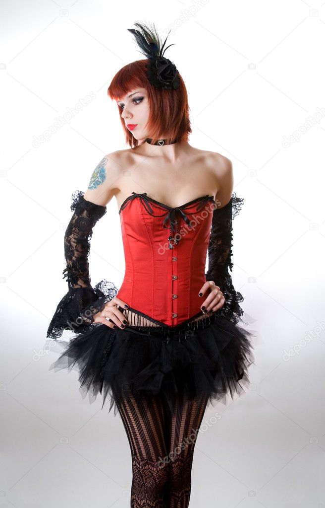 Attractive woman in red corset and black skirt