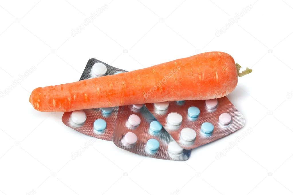 Carrots and packing with vitamins — Stock Photo © Observer 5411791