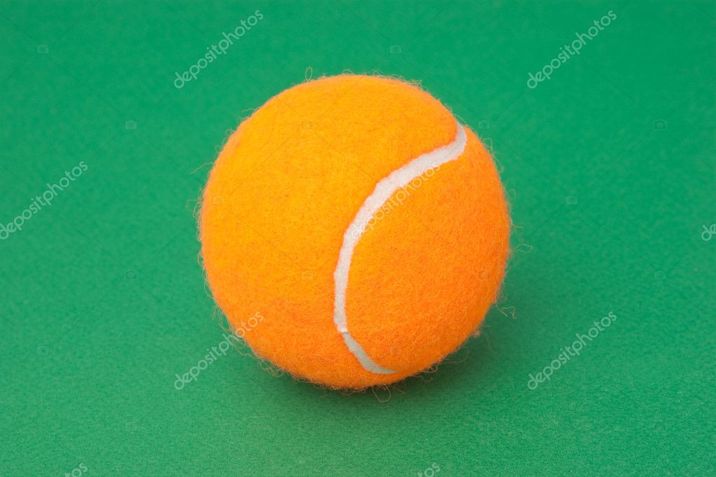 Orange tennis ball on green background — Stock Photo © Observer 5419355