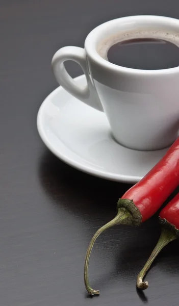Coffee cup and red peppers
