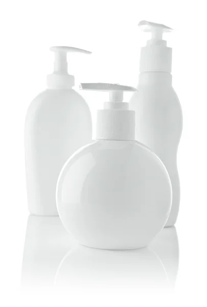 Trzy białe spray butelkach — Zdjęcie stockowe