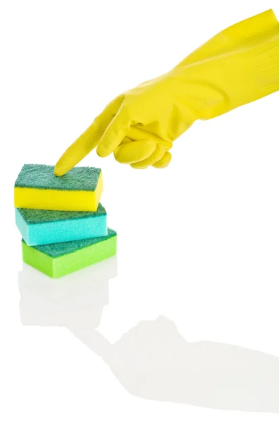 Hand in glove on sponges — Stock Photo, Image