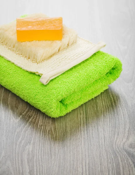Soap and bast on towel — Stock Photo, Image