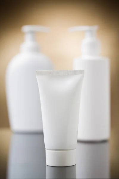 Tube on the background of the sprays — Stock Photo, Image