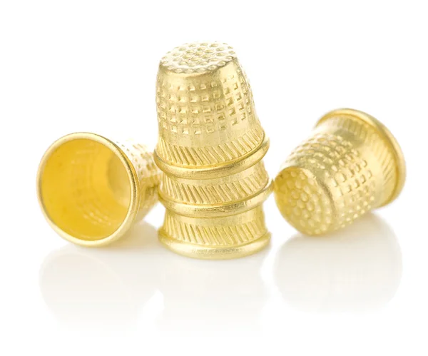 Five golden timbles isolated on white background — Stock Photo, Image
